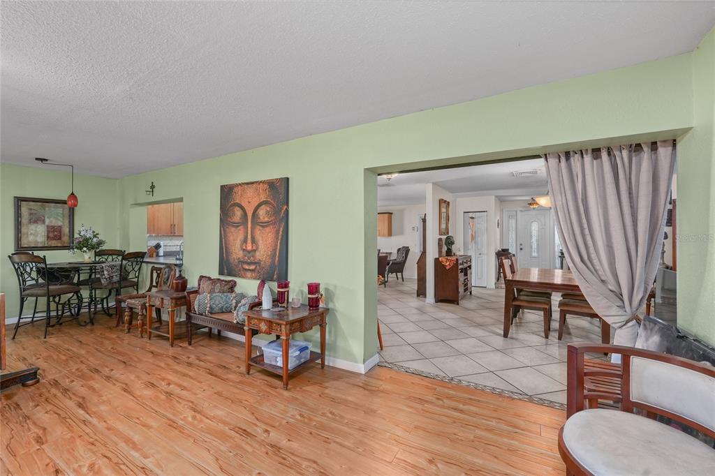1432 Windmill Pointe Road Palm Harbor, FL 34685 - Photo 35 of 44 a living room with furniture and wooden floor
