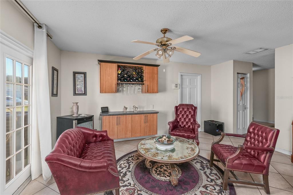 1432 Windmill Pointe Road Palm Harbor, FL 34685 - Photo 38 of 44 a living room with furniture and a rug