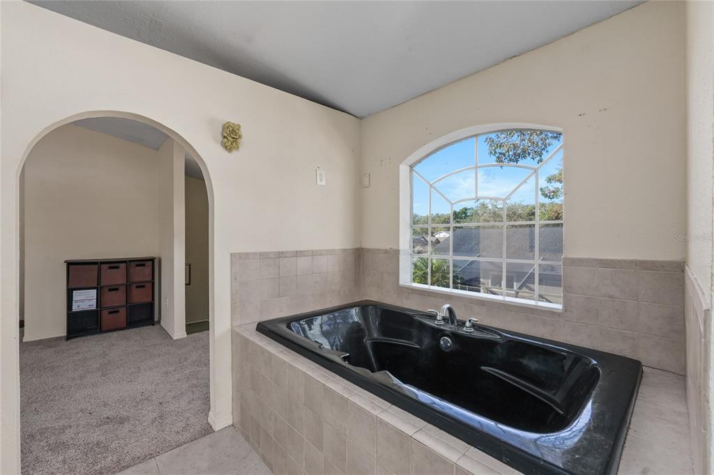 1432 Windmill Pointe Road Palm Harbor, FL 34685 - Photo 40 of 44 a kitchen that has a sink and a stove