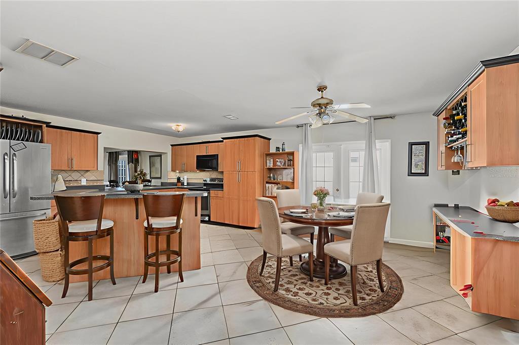 1432 Windmill Pointe Road Palm Harbor, FL 34685 - Photo 6 of 44 a view of a dining room with furniture
