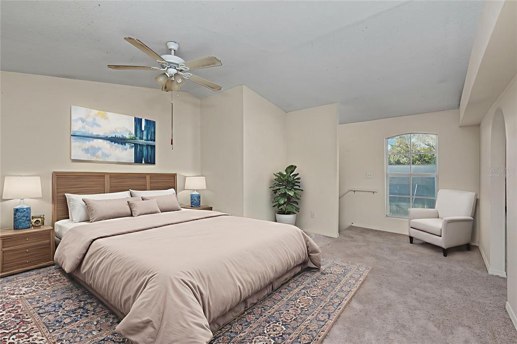 1432 Windmill Pointe Road Palm Harbor, FL 34685 - Photo 9 of 44 a bedroom with a bed and a window