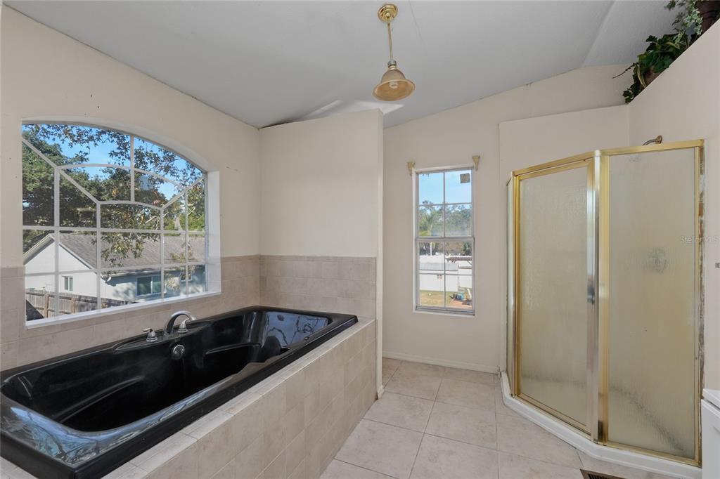 1432 Windmill Pointe Road Palm Harbor, FL 34685 - Photo 10 of 44 a kitchen that has a sink and a stove