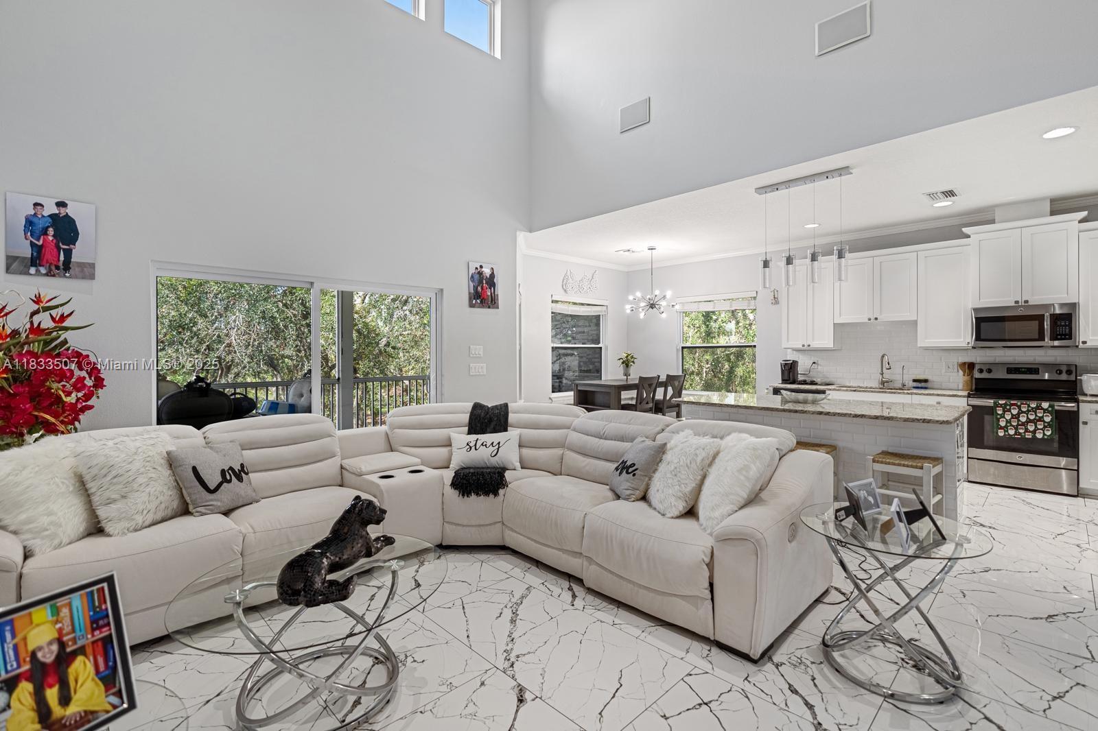 4836 Troydale Road Tampa, FL 33615 - Photo 15 of 52 a living room with furniture and a large window