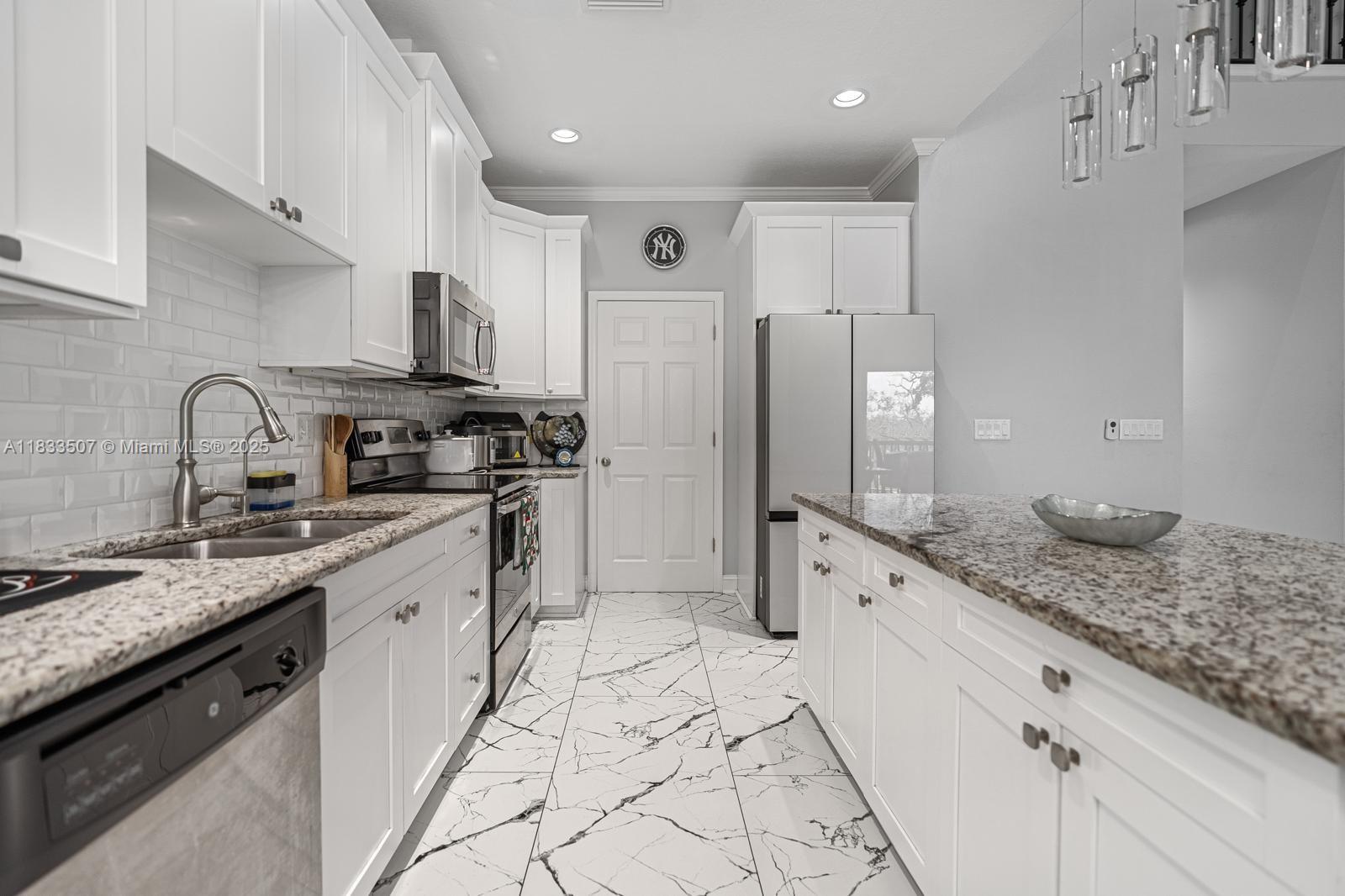 4836 Troydale Road Tampa, FL 33615 - Photo 19 of 52 a open kitchen with stainless steel appliances granite countertop a sink stove and refrigerator