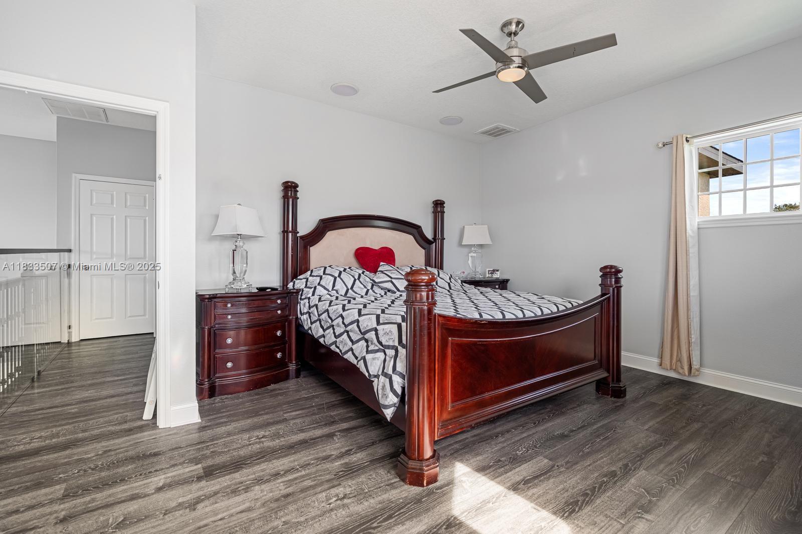 4836 Troydale Road Tampa, FL 33615 - Photo 25 of 52 a bed room with furniture and window