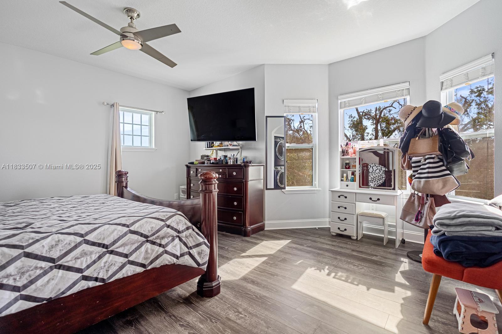 4836 Troydale Road Tampa, FL 33615 - Photo 27 of 52 a bedroom with a bed and a flat screen tv