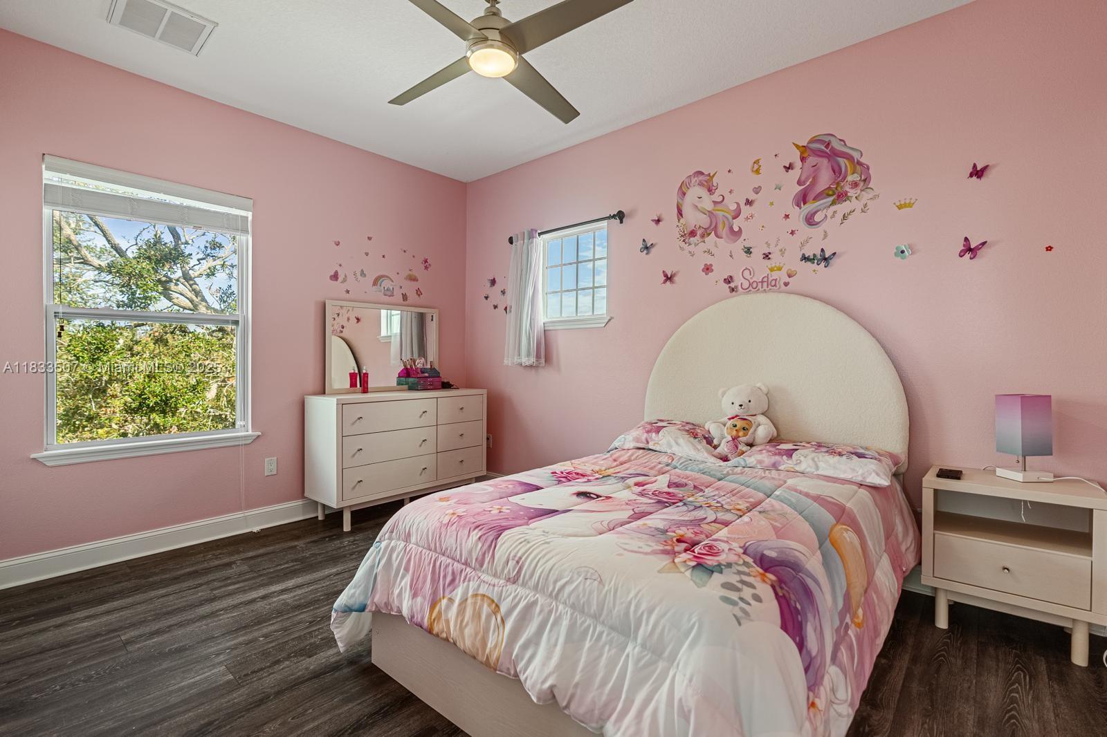 4836 Troydale Road Tampa, FL 33615 - Photo 36 of 52 a bedroom with a bed and a window