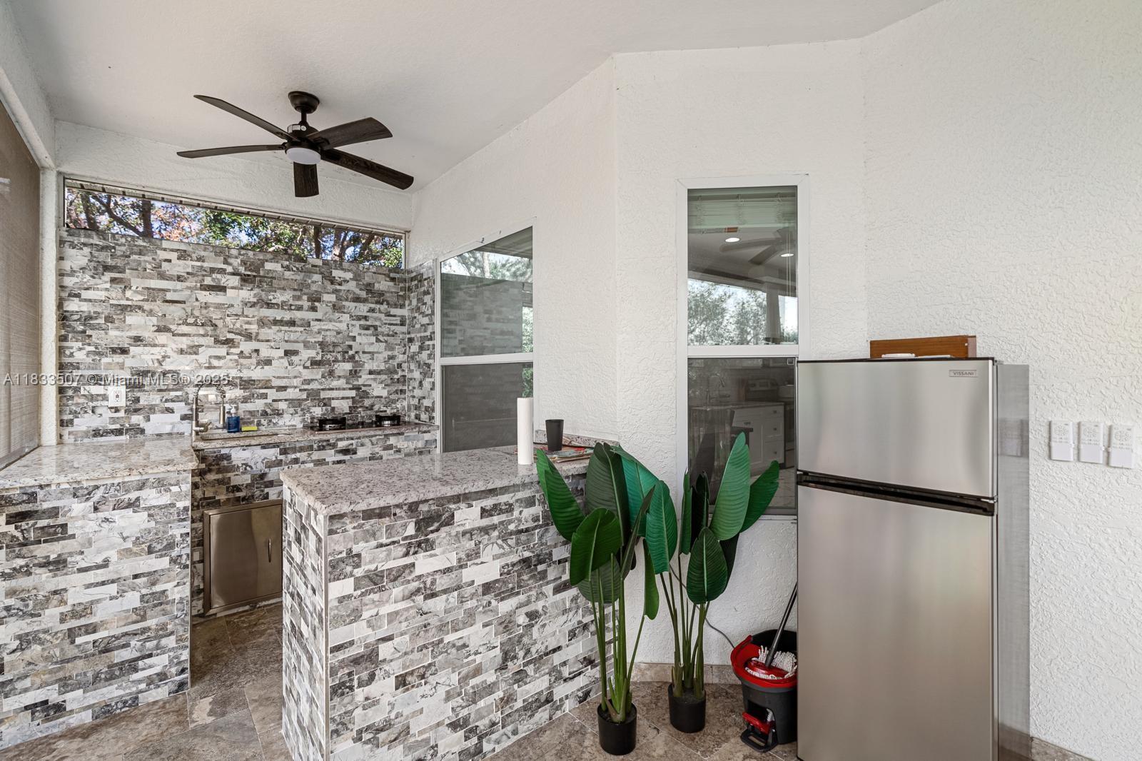 4836 Troydale Road Tampa, FL 33615 - Photo 42 of 52 a view of a hallway with wooden floor and a potted plant
