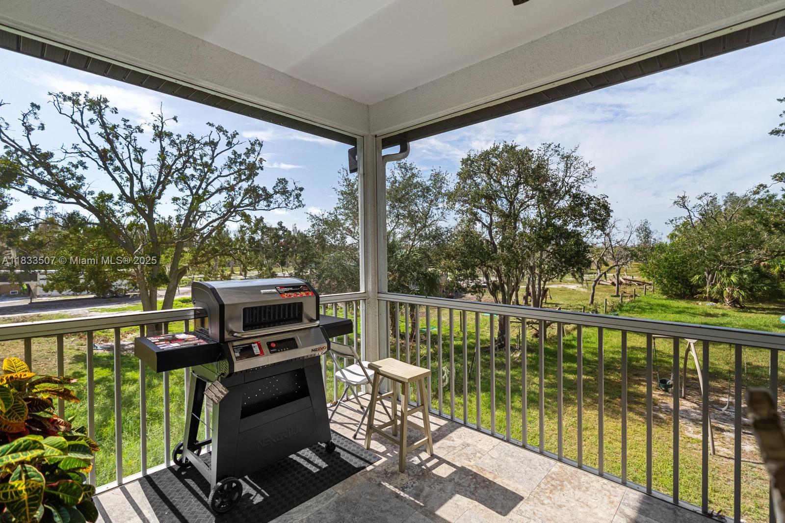4836 Troydale Road Tampa, FL 33615 - Photo 43 of 52 a view of a balcony with chairs