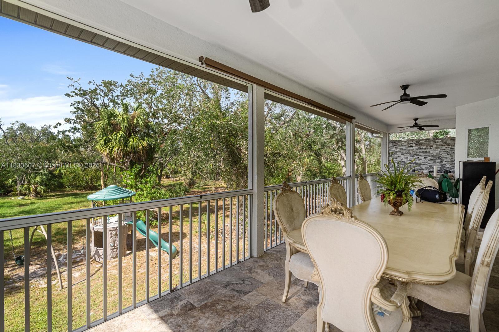 4836 Troydale Road Tampa, FL 33615 - Photo 44 of 52 a outdoor dining space with furniture and garden view