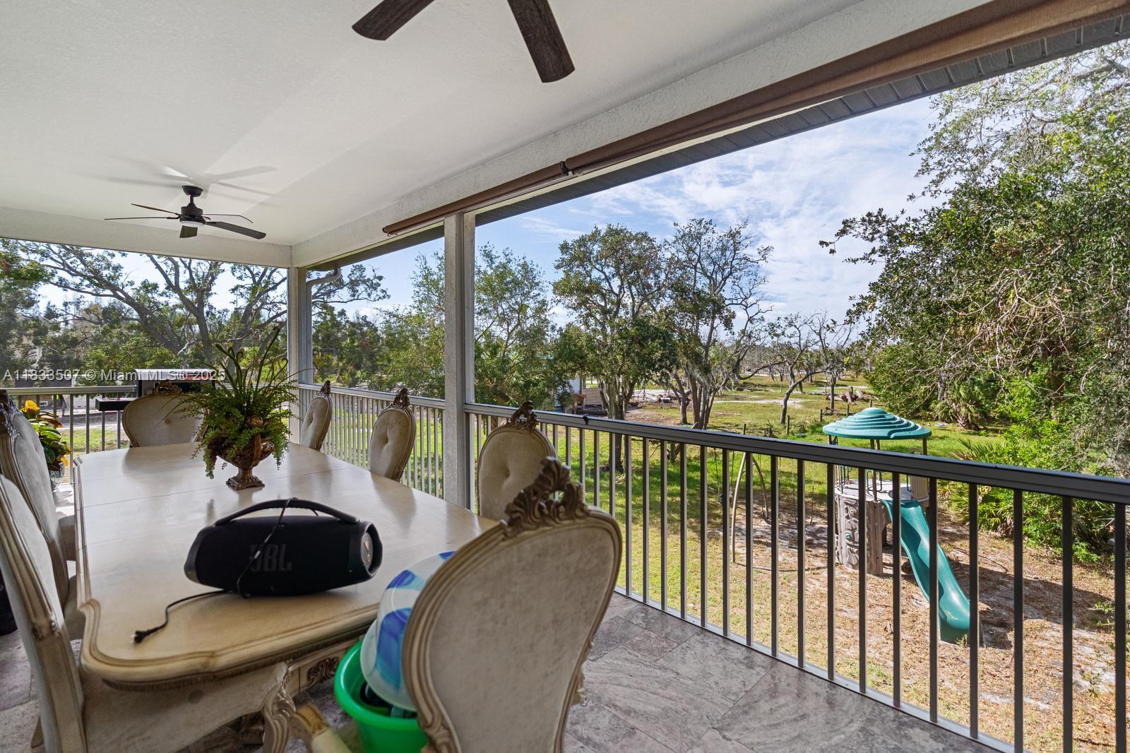 4836 Troydale Road Tampa, FL 33615 - Photo 46 of 52 a view of a living room and balcony