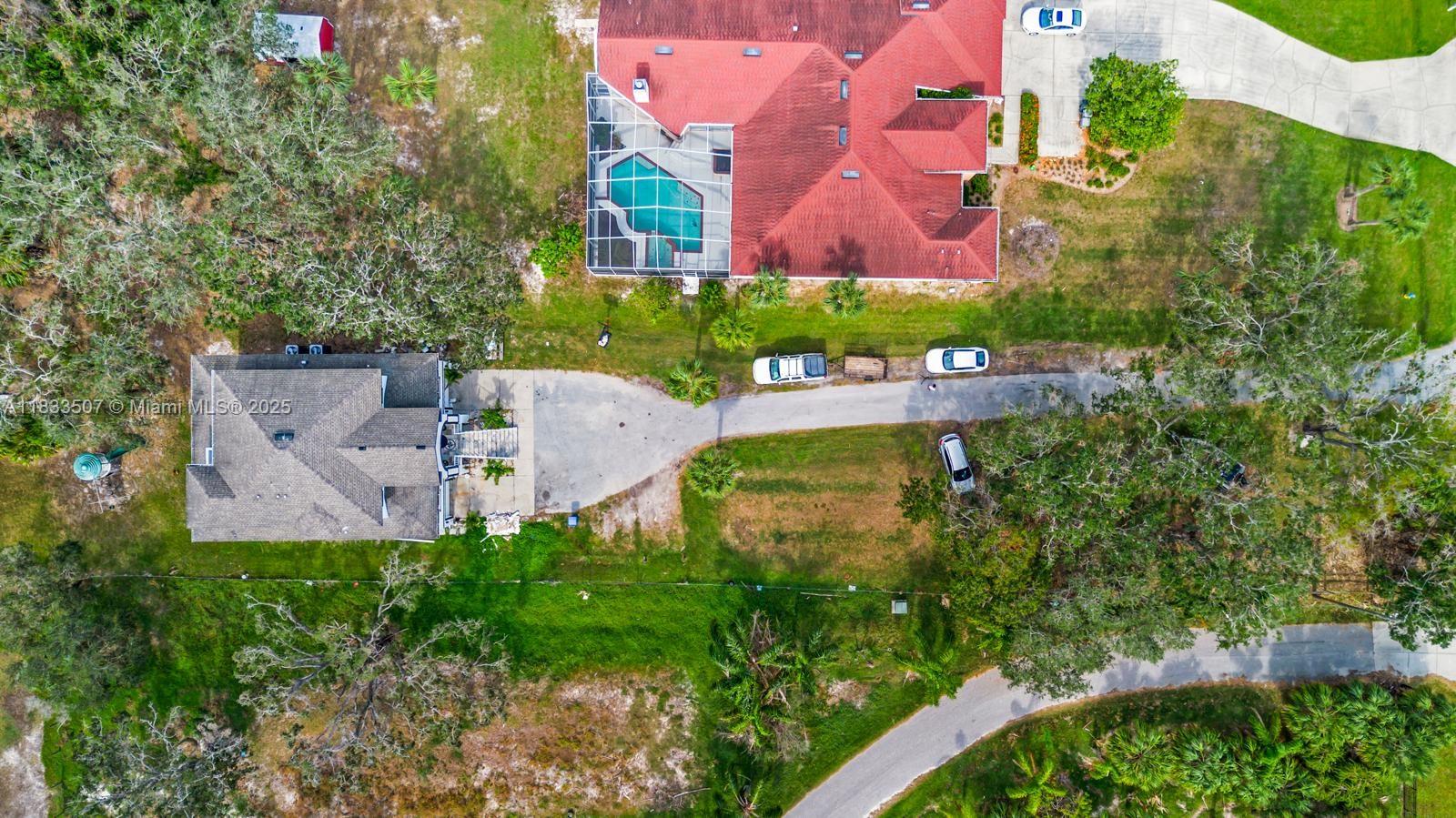 4836 Troydale Road Tampa, FL 33615 - Photo 49 of 52 an aerial view of a house with a garden and yard