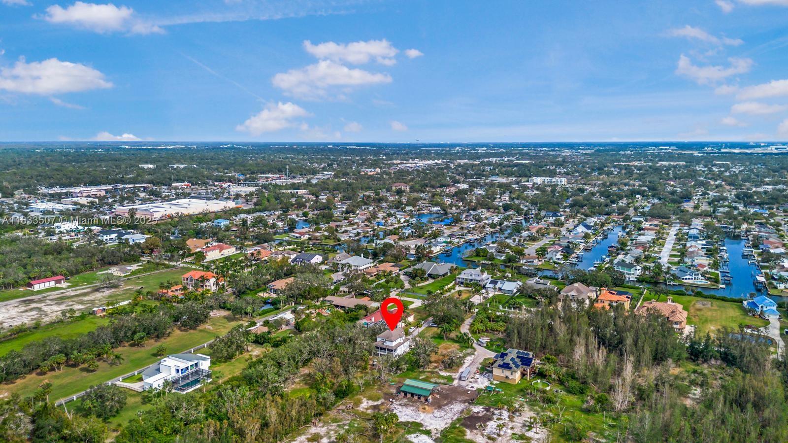 4836 Troydale Road Tampa, FL 33615 - Photo 50 of 52 an aerial view of residential houses with outdoor space and trees