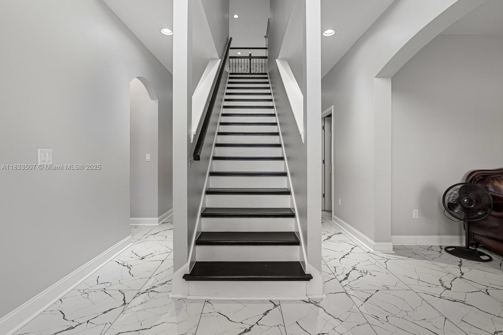 4836 Troydale Road Tampa, FL 33615 - Photo 9 of 52 a view of entryway and hall with wooden floor