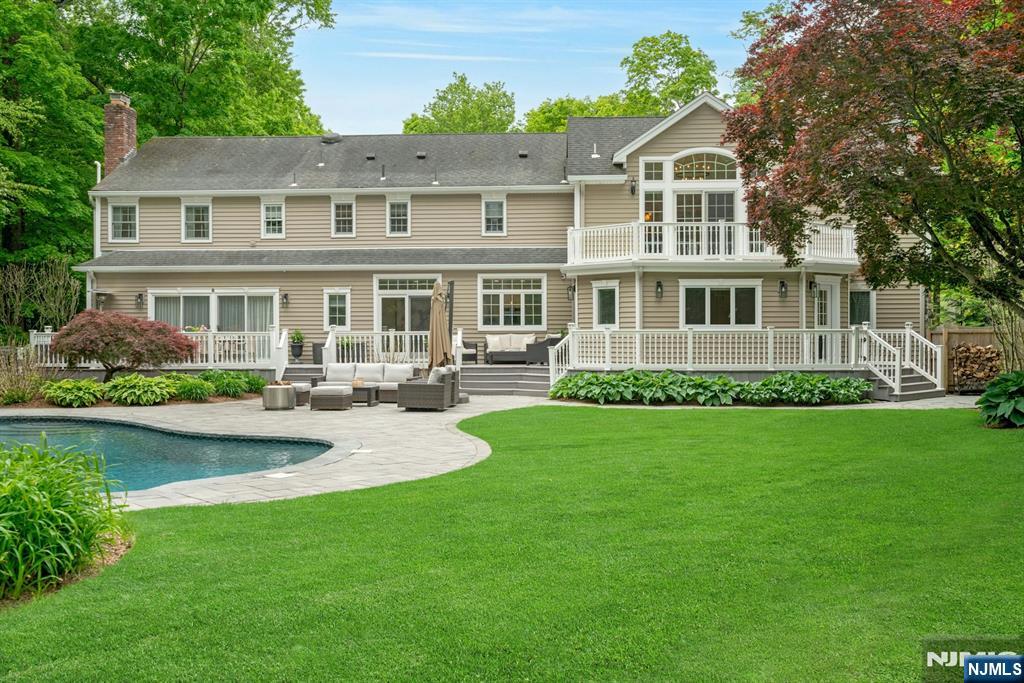 48 Hopper Farm Road Upper Saddle River, NJ 07458 - Photo 39 of 43 a front view of a house with a yard and potted plants