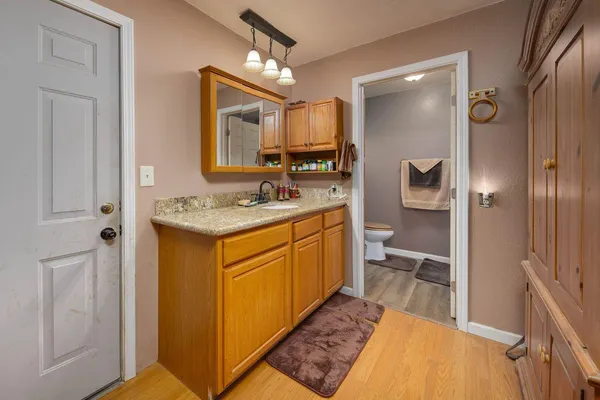 a bathroom with a toilet and a sink