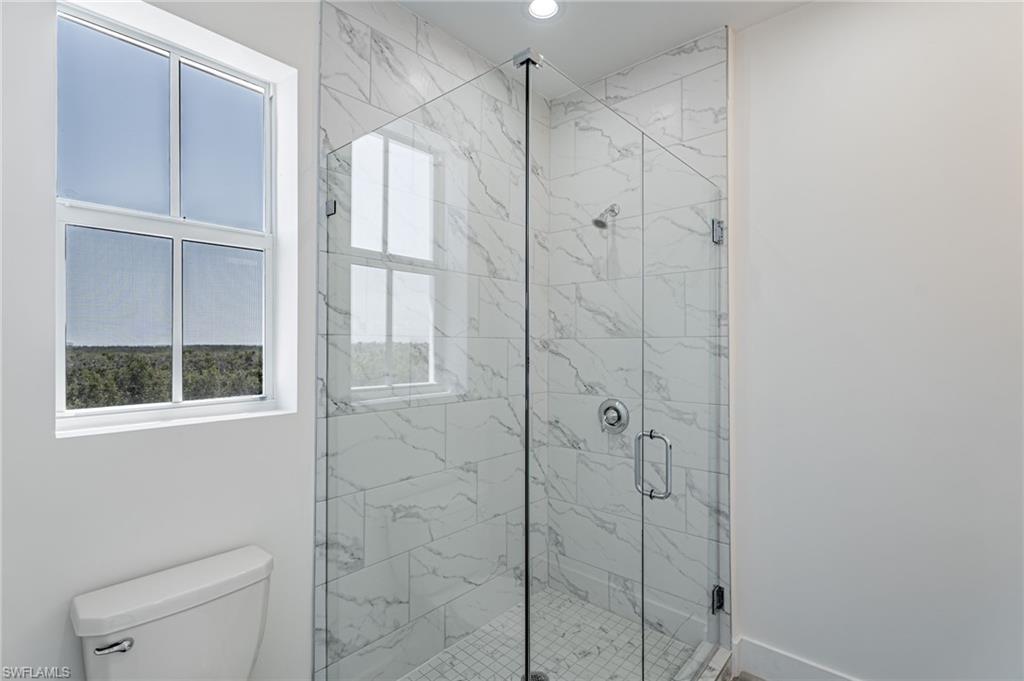 5816 Shell Cove Drive Cape Coral, FL 33914 - Photo 13 of 16 Full bathroom featuring a marble finish shower and recessed lighting