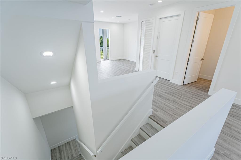 5816 Shell Cove Drive Cape Coral, FL 33914 - Photo 3 of 16 Stairs featuring recessed lighting and wood finished floors