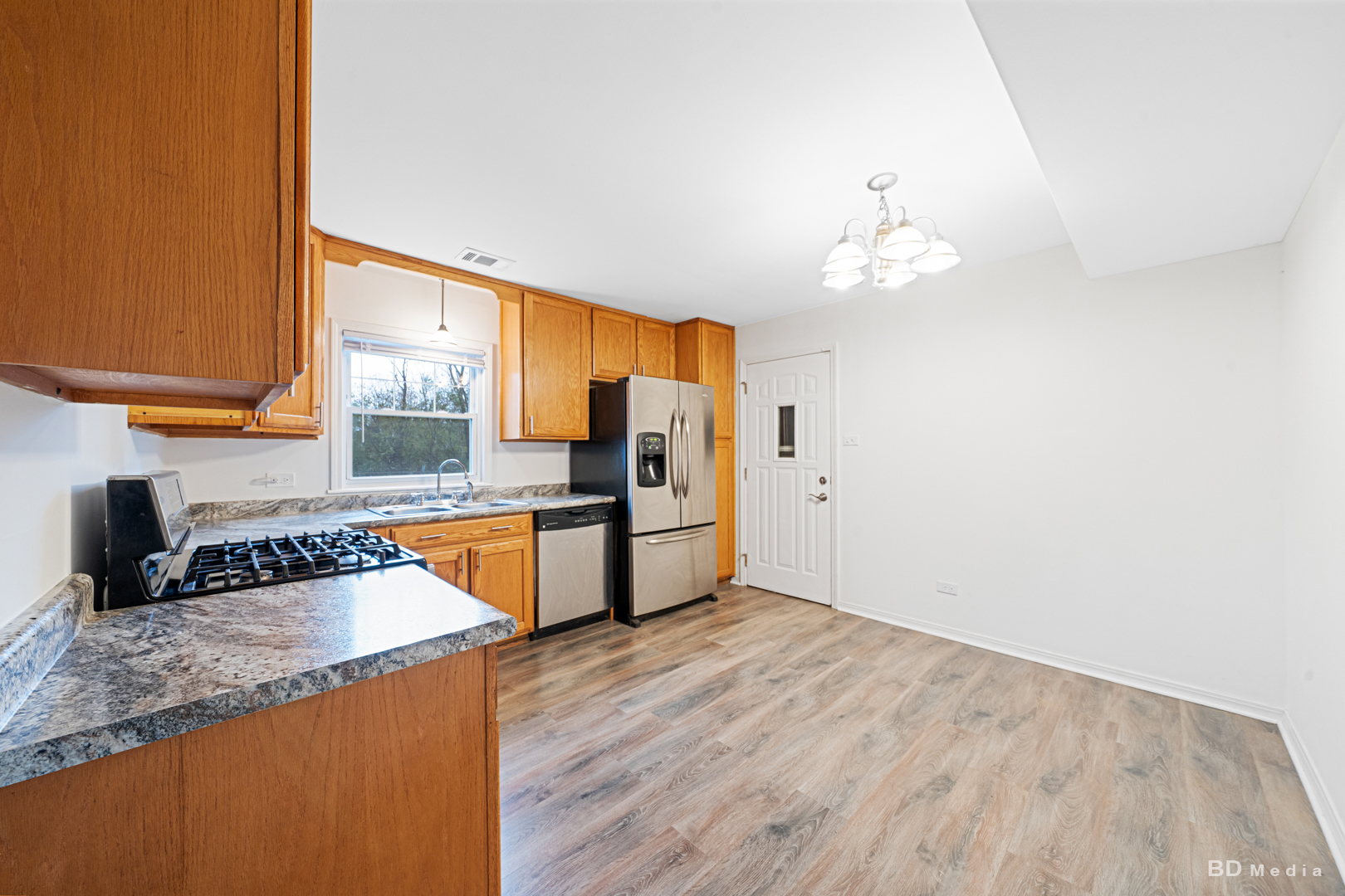 5503 Georgetown Drive Matteson, IL 60443 - Photo 13 of 27 a kitchen with stainless steel appliances granite countertop a sink a stove and a refrigerator
