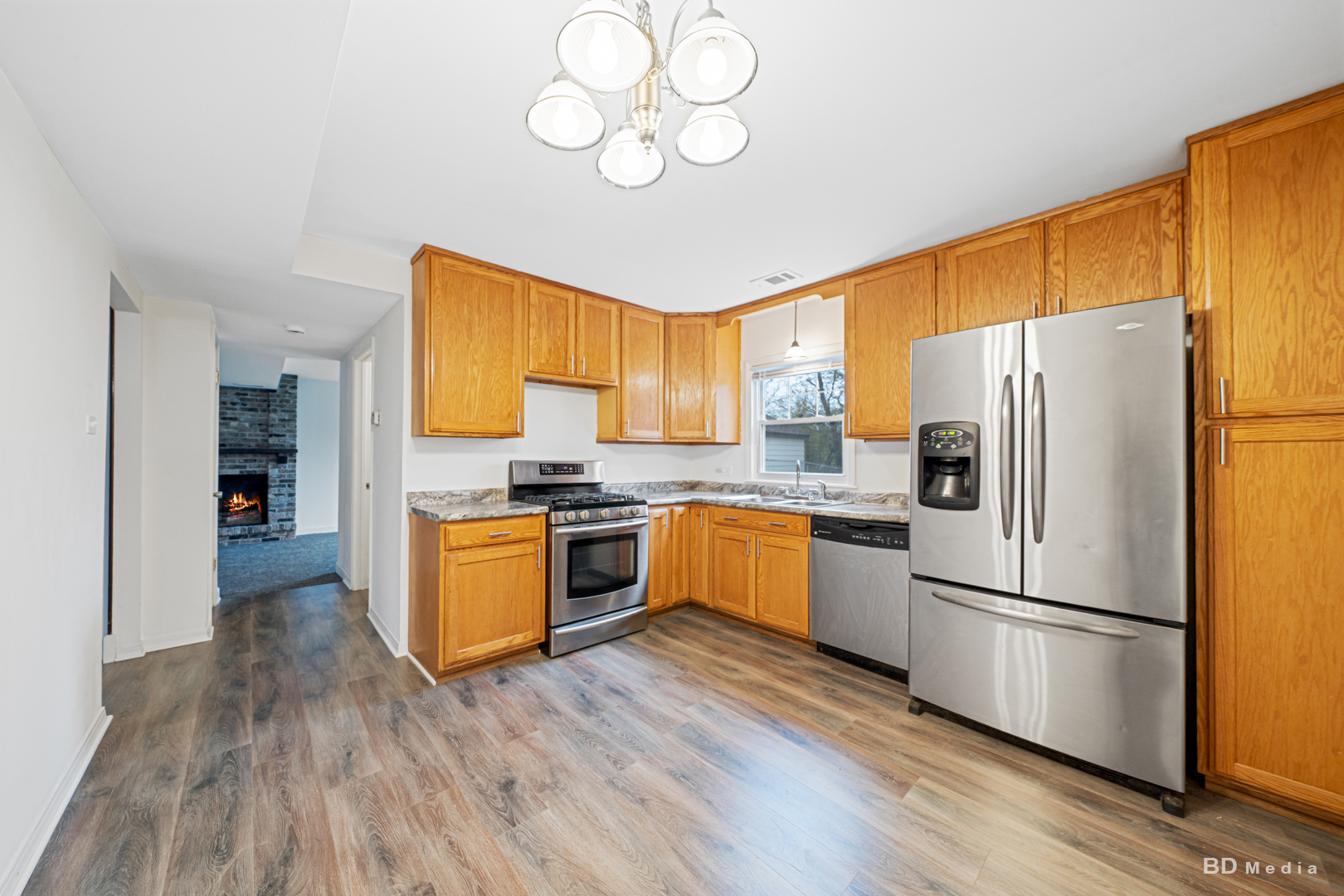 5503 Georgetown Drive Matteson, IL 60443 - Photo 15 of 27 a kitchen with stainless steel appliances granite countertop a refrigerator a stove top oven a sink and dishwasher with wooden floor