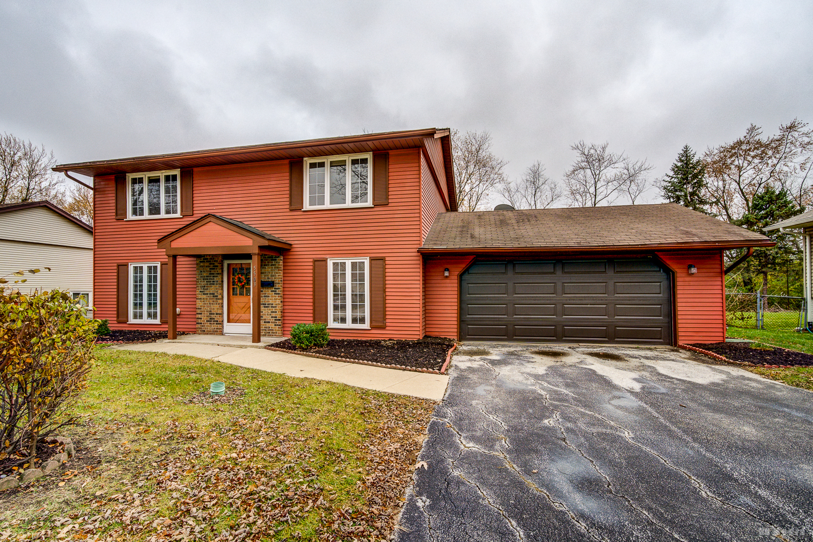 5503 Georgetown Drive Matteson, IL 60443 - Photo 2 of 27 a front view of a house with a yard and garage