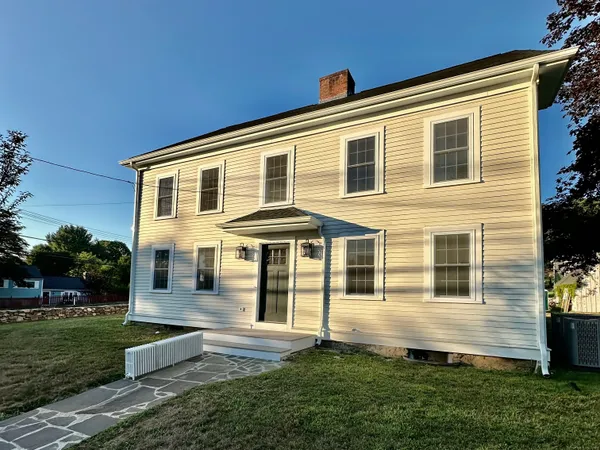 a front view of a house with a yard
