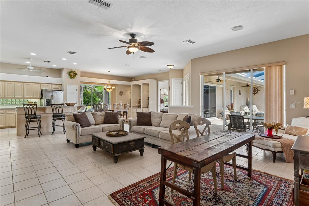 10120 Shortleaf Court Weeki Wachee, FL 34613 - Photo 19 of 95 a living room with furniture and a table
