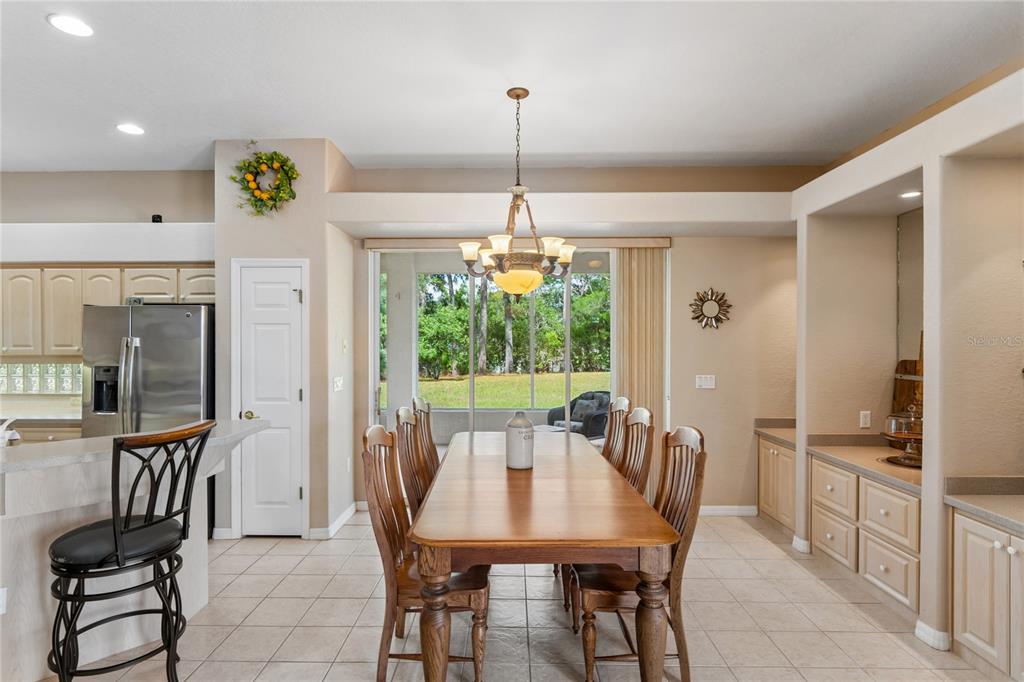 10120 Shortleaf Court Weeki Wachee, FL 34613 - Photo 29 of 95 a view of a dining room with furniture window and outside view