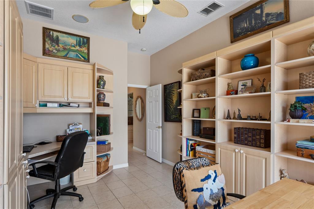 10120 Shortleaf Court Weeki Wachee, FL 34613 - Photo 45 of 95 a view of a workspace with furniture and toys