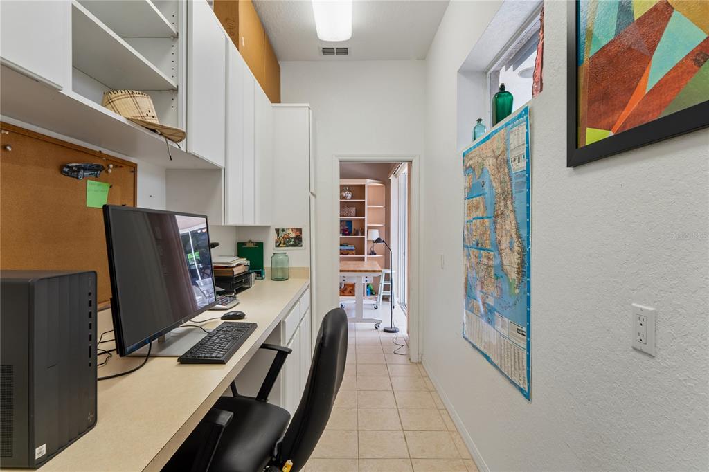 10120 Shortleaf Court Weeki Wachee, FL 34613 - Photo 47 of 95 a view of a hallway with workspace and living room