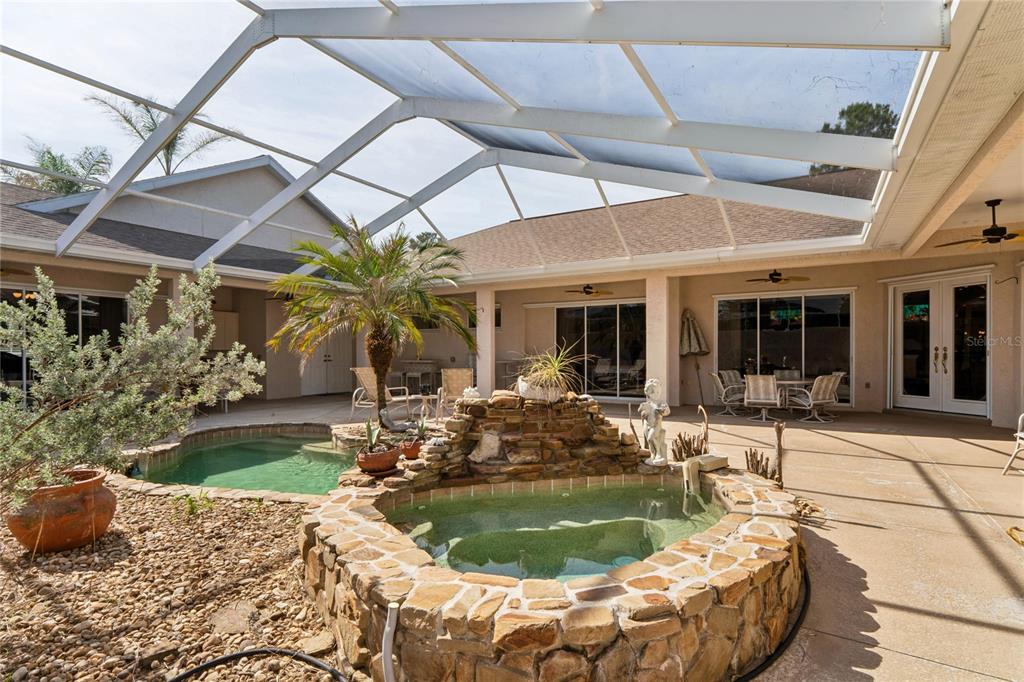 10120 Shortleaf Court Weeki Wachee, FL 34613 - Photo 66 of 95 a view of a house with backyard sitting area and swimming pool