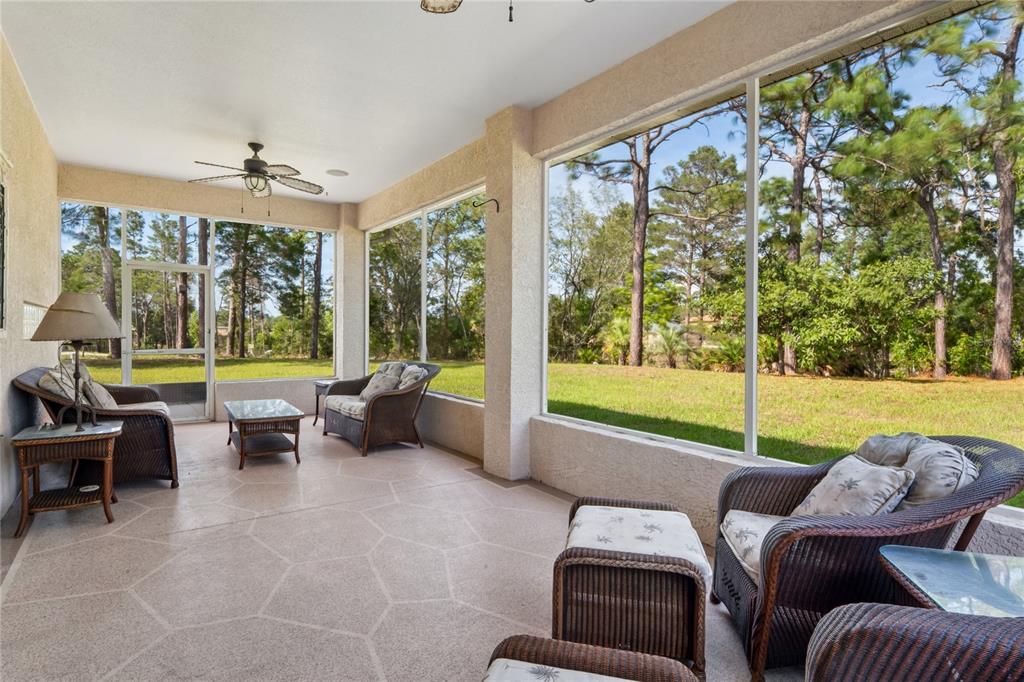 10120 Shortleaf Court Weeki Wachee, FL 34613 - Photo 74 of 95 a living room with furniture and a large window