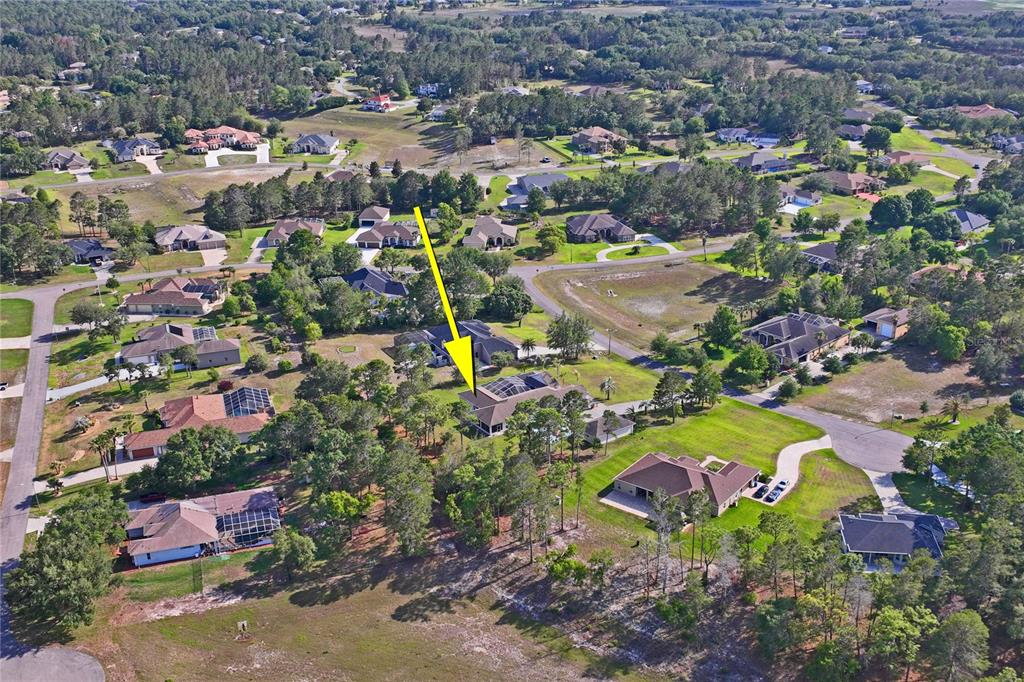 10120 Shortleaf Court Weeki Wachee, FL 34613 - Photo 93 of 95 an aerial view of residential house with outdoor space and swimming pool