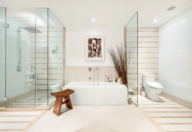 a kitchen with a dining table chairs sink and cabinets
