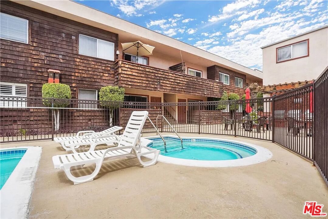 5403 Newcastle Avenue, Unit 69 Encino, CA 91316 - Photo 29 of 34 a view of a chairs and table in the patio