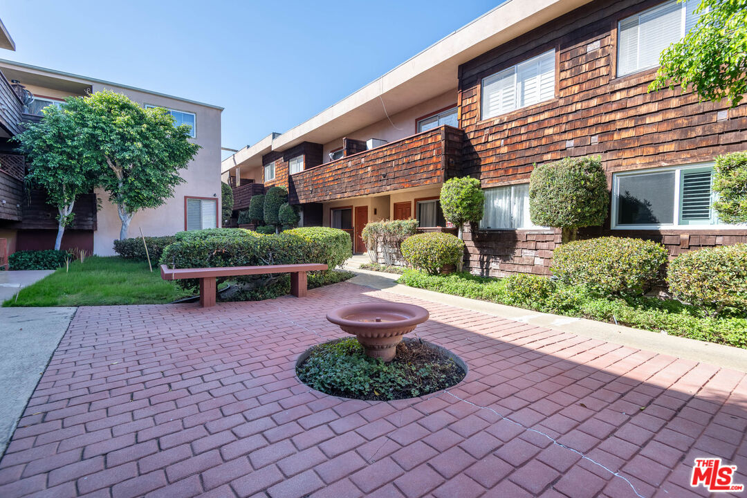 5403 Newcastle Avenue, Unit 69 Encino, CA 91316 - Photo 30 of 34 a front view of a house with garden