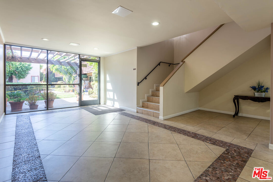 5403 Newcastle Avenue, Unit 69 Encino, CA 91316 - Photo 32 of 34 a view of an empty room with a window