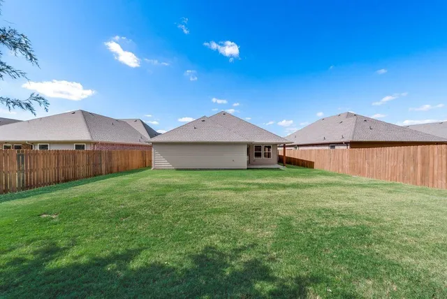 a front view of house with yard and seating area