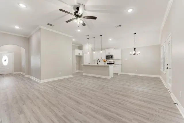 a view of a kitchen with a dishwasher kitchen stove and a wooden cabinets