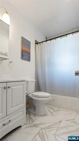 a bathroom with a toilet and a sink