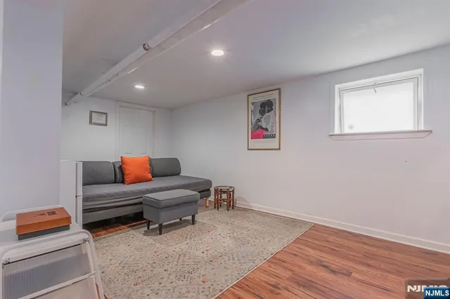 a living room with furniture and a rug