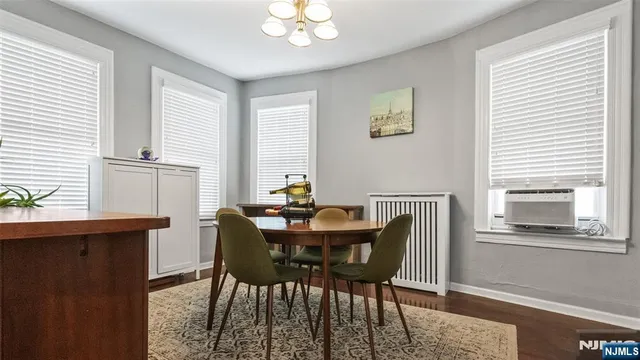 a view of a dining room with furniture and window