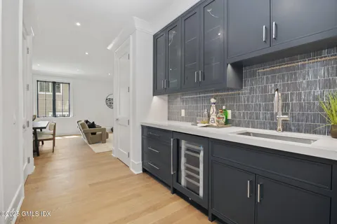 a kitchen with stainless steel appliances granite countertop a sink dishwasher stove and cabinets