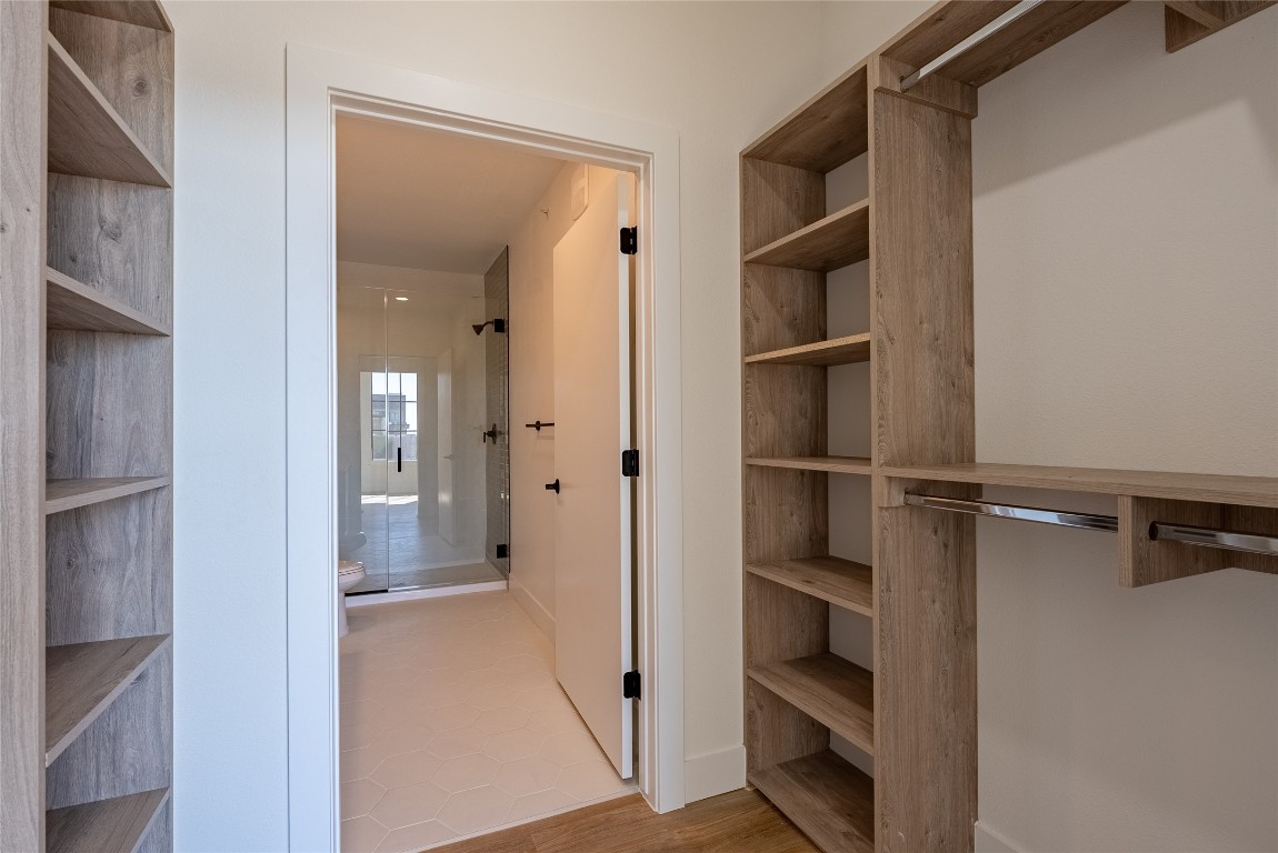 4315 South Congress Avenue, Unit 504 Austin, TX 78745 - Photo 12 of 21 Spacious closet with light wood-type flooring