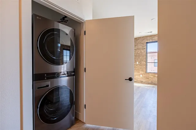 a close view of a utility room with dryer and washer