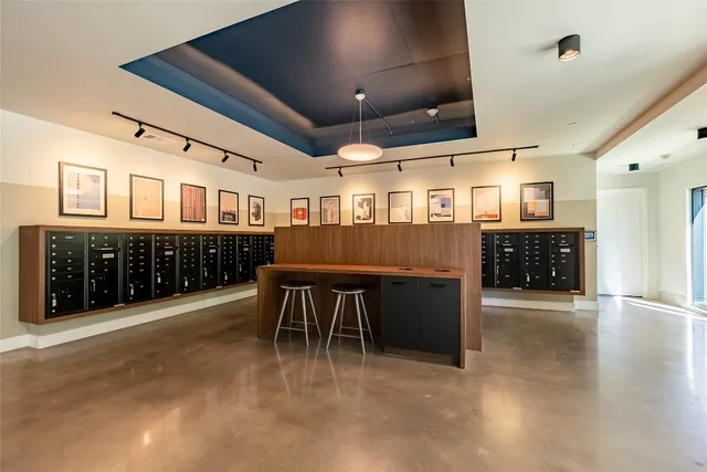 a view of a room with wooden floor and windows