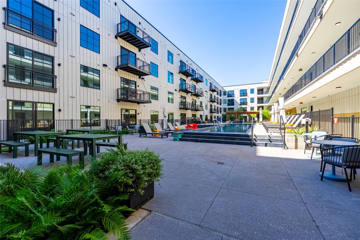 4315 South Congress Avenue, Unit 504 Austin, TX 78745 - Photo 18 of 21 View of property's community featuring a swimming pool and a patio area