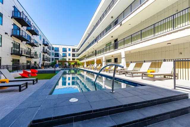 a view of a swimming pool with a lounge chairs