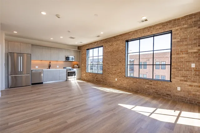 a view of a kitchen with a sink and a window