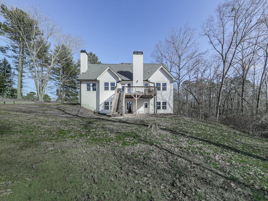 711 Carver Mill Road Talking Rock, GA 30175 - Photo 12 of 39 a view of a house with a yard